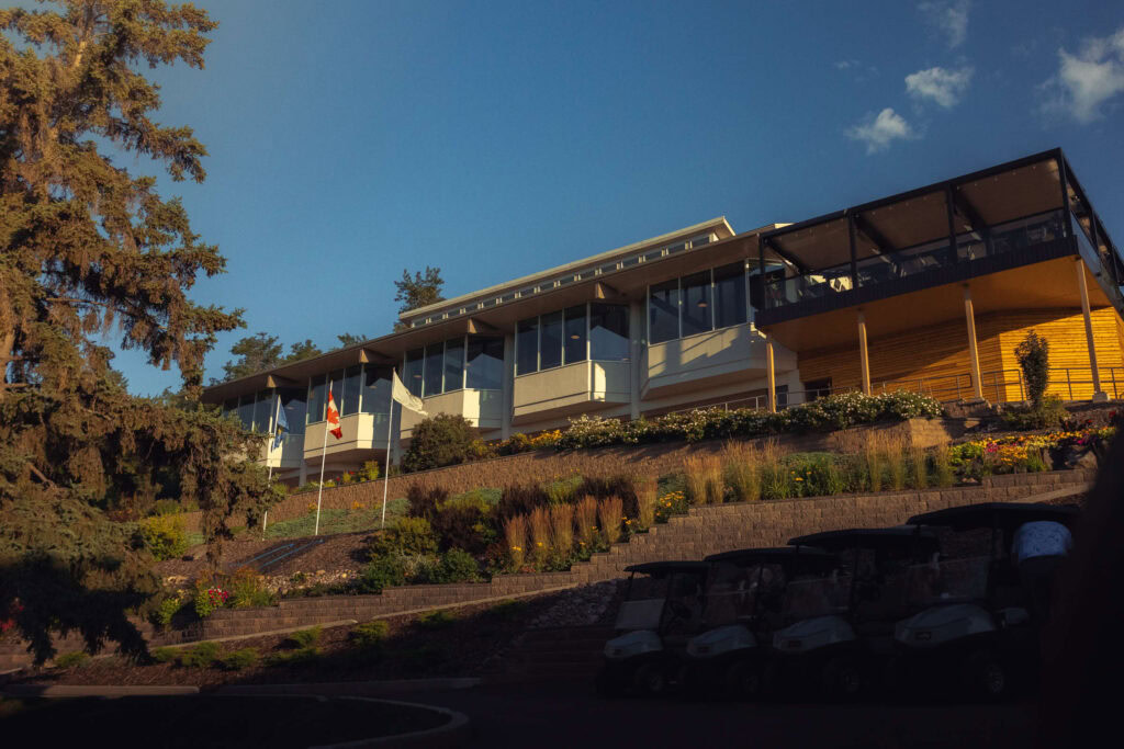 Luxurious Highlands Golf Club clubhouse with scenic mountain views and well-manicured landscape.